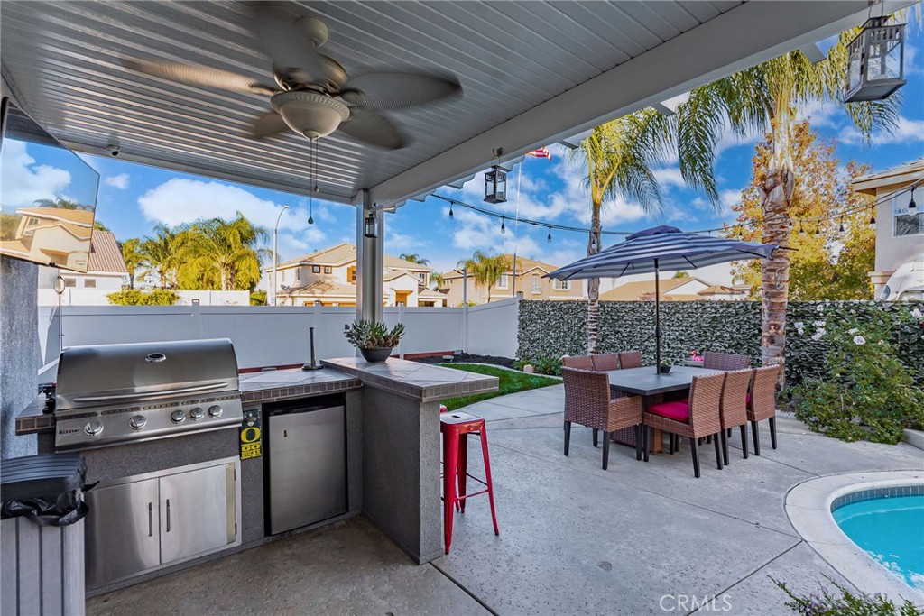 29602 Cool Meadow Drive Menifee, CA 92584 - Photo 25 of 31 a view of a chairs and table in a patio