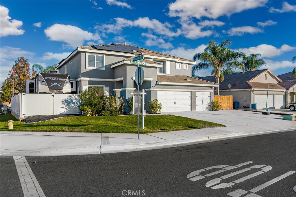 29602 Cool Meadow Drive Menifee, CA 92584 - Photo 28 of 31 a front view of a house with a garden