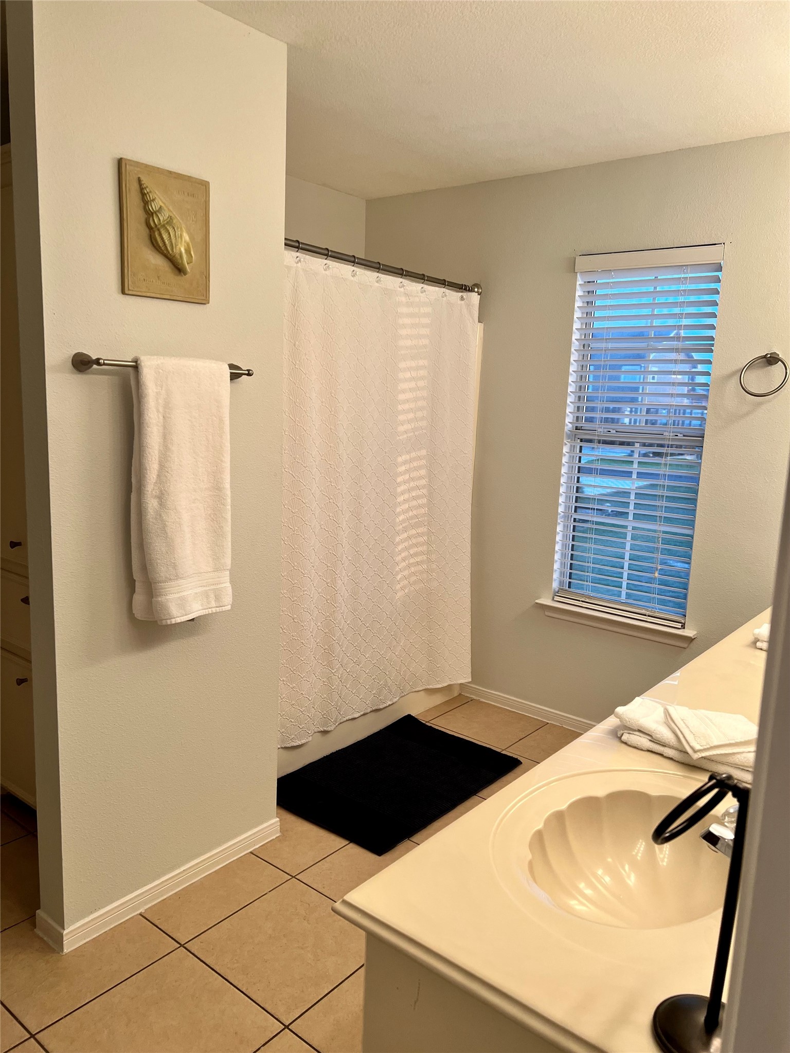 125 Marlin Avenue Freeport, TX 77541 - Photo 4 of 11 a view of a kitchen that has a sink and a window in it