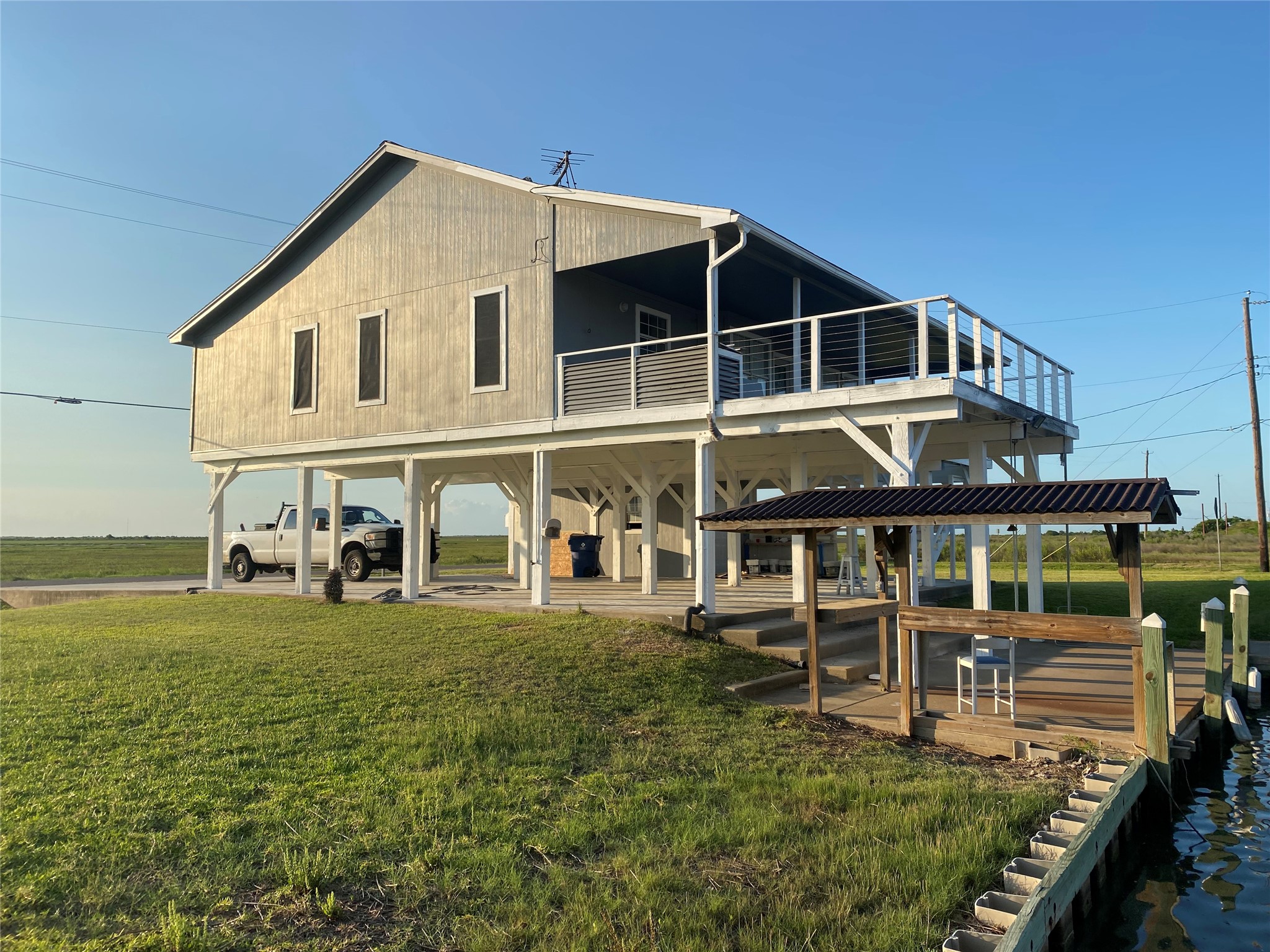 125 Marlin Avenue Freeport, TX 77541 - Photo 9 of 11 a large house with a big yard and large trees