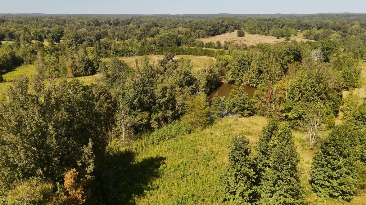 0 Middleburg Road Decaturville, TN 38329 - Photo 26 of 32 an aerial view of residential houses with outdoor space and trees