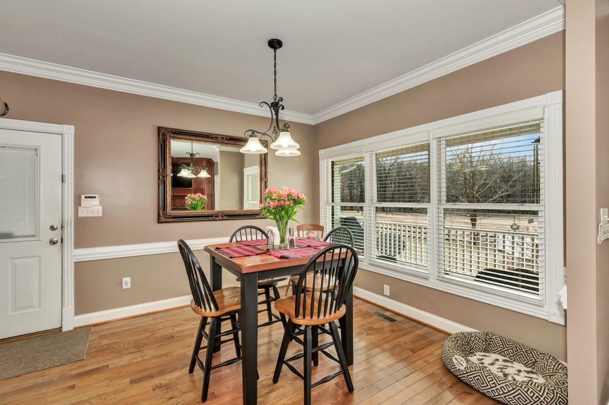 18789 Wells Road Athens, AL 35613 - Photo 12 of 40 a view of a dining room with furniture window and wooden floor
