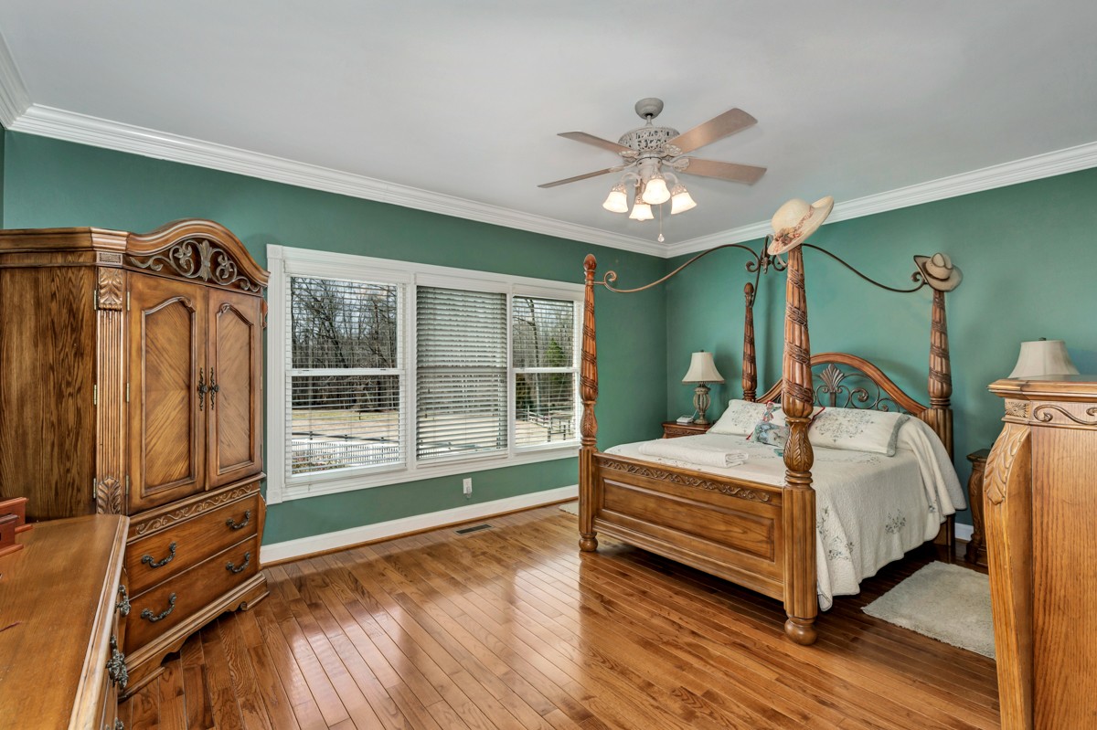 18789 Wells Road Athens, AL 35613 - Photo 14 of 40 a spacious bedroom with a bed and a large window