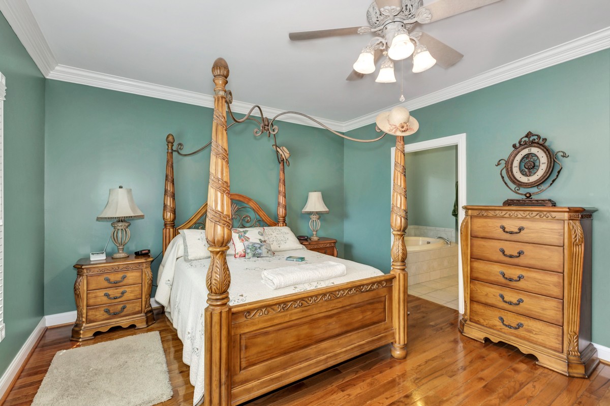 18789 Wells Road Athens, AL 35613 - Photo 15 of 40 a bed room with a bed and a chair