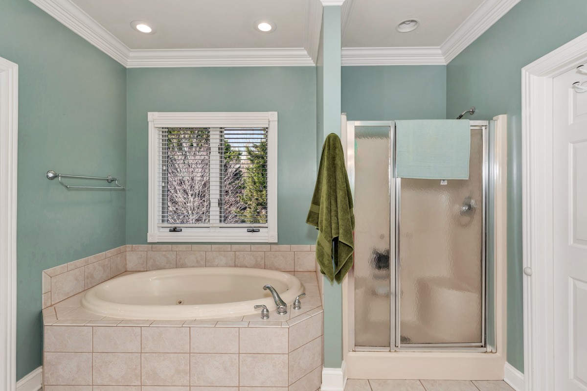 18789 Wells Road Athens, AL 35613 - Photo 17 of 40 a bathroom with a bathtub and a shower