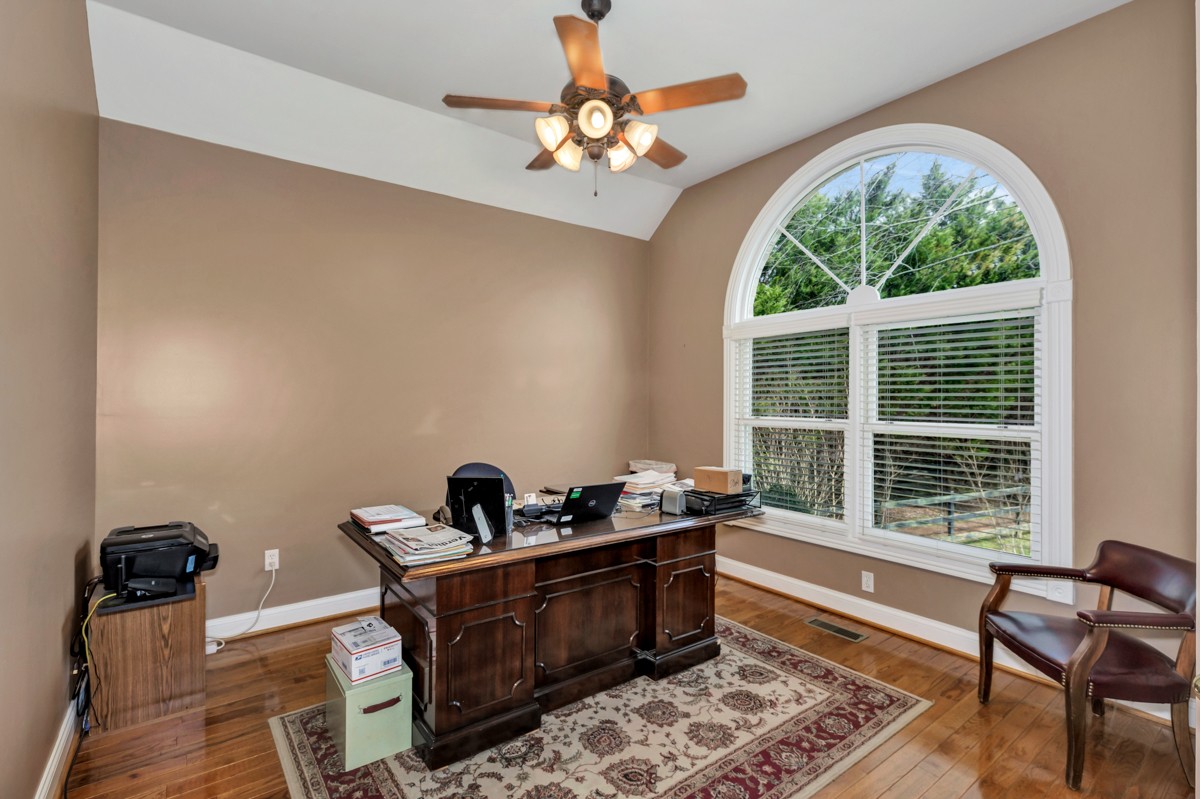 18789 Wells Road Athens, AL 35613 - Photo 18 of 40 a room with chandelier fan and windows