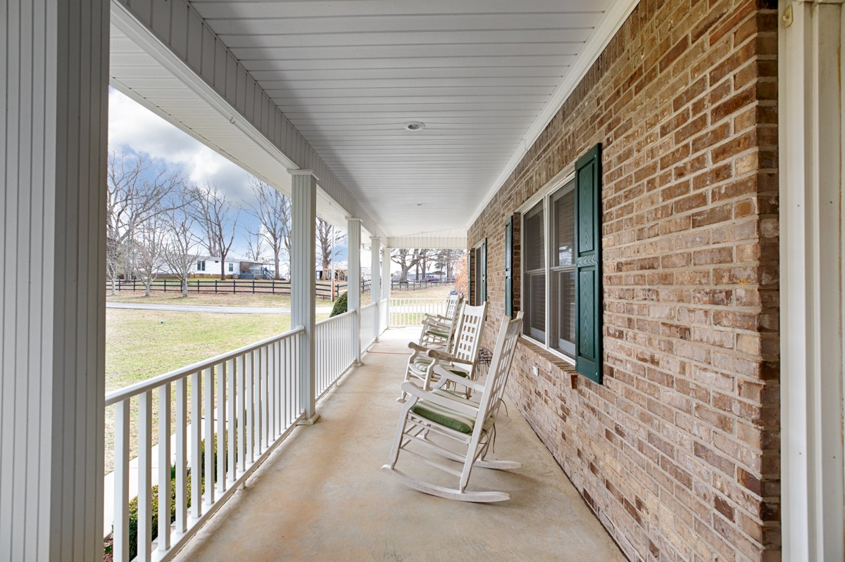 18789 Wells Road Athens, AL 35613 - Photo 3 of 40 a view of a porch with chairs and backyard