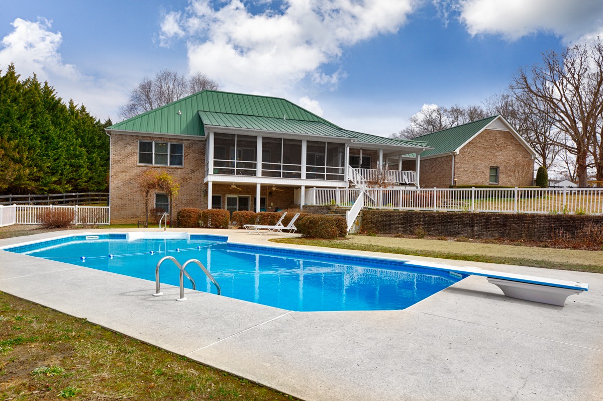 18789 Wells Road Athens, AL 35613 - Photo 30 of 40 a view of a house with swimming pool and sitting area