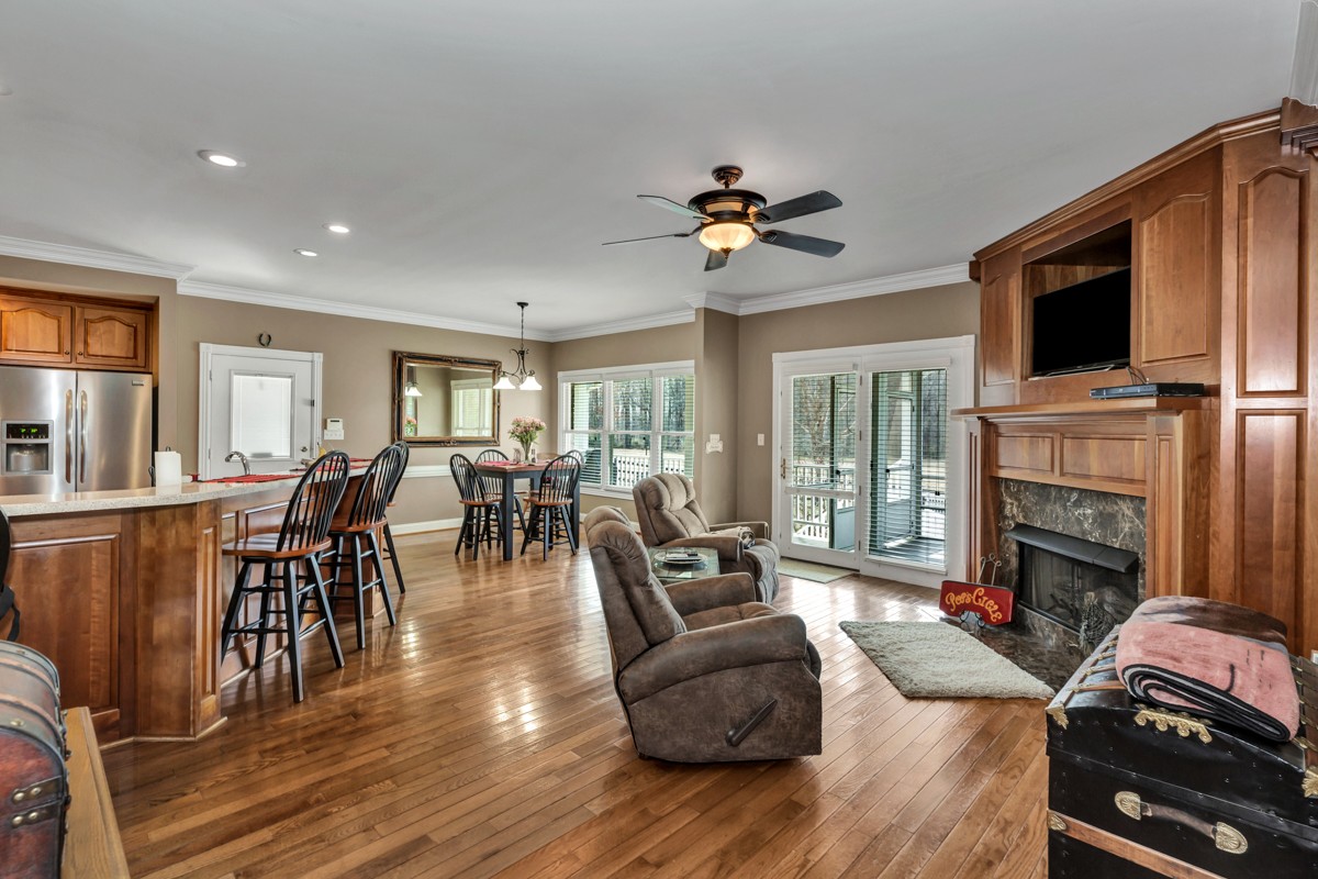 18789 Wells Road Athens, AL 35613 - Photo 7 of 40 a living room with furniture fireplace and flat screen tv