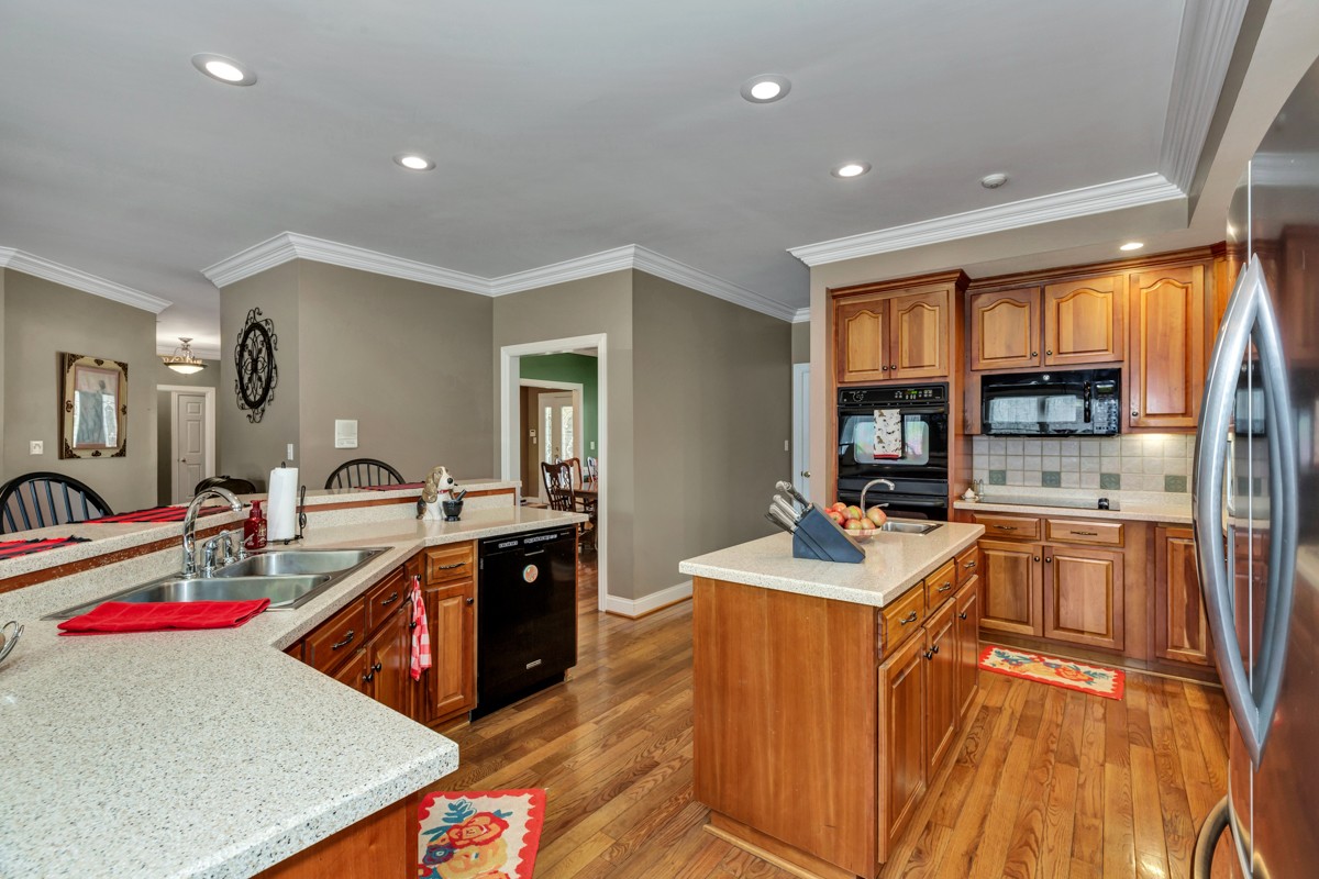 18789 Wells Road Athens, AL 35613 - Photo 10 of 40 a room with stainless steel appliances granite countertop sink stove and refrigerator