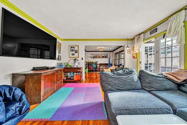 a living room with furniture fireplace and a flat screen tv