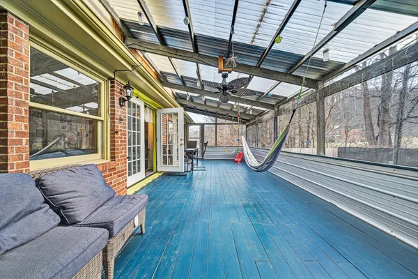 a living room with wooden floors and furniture