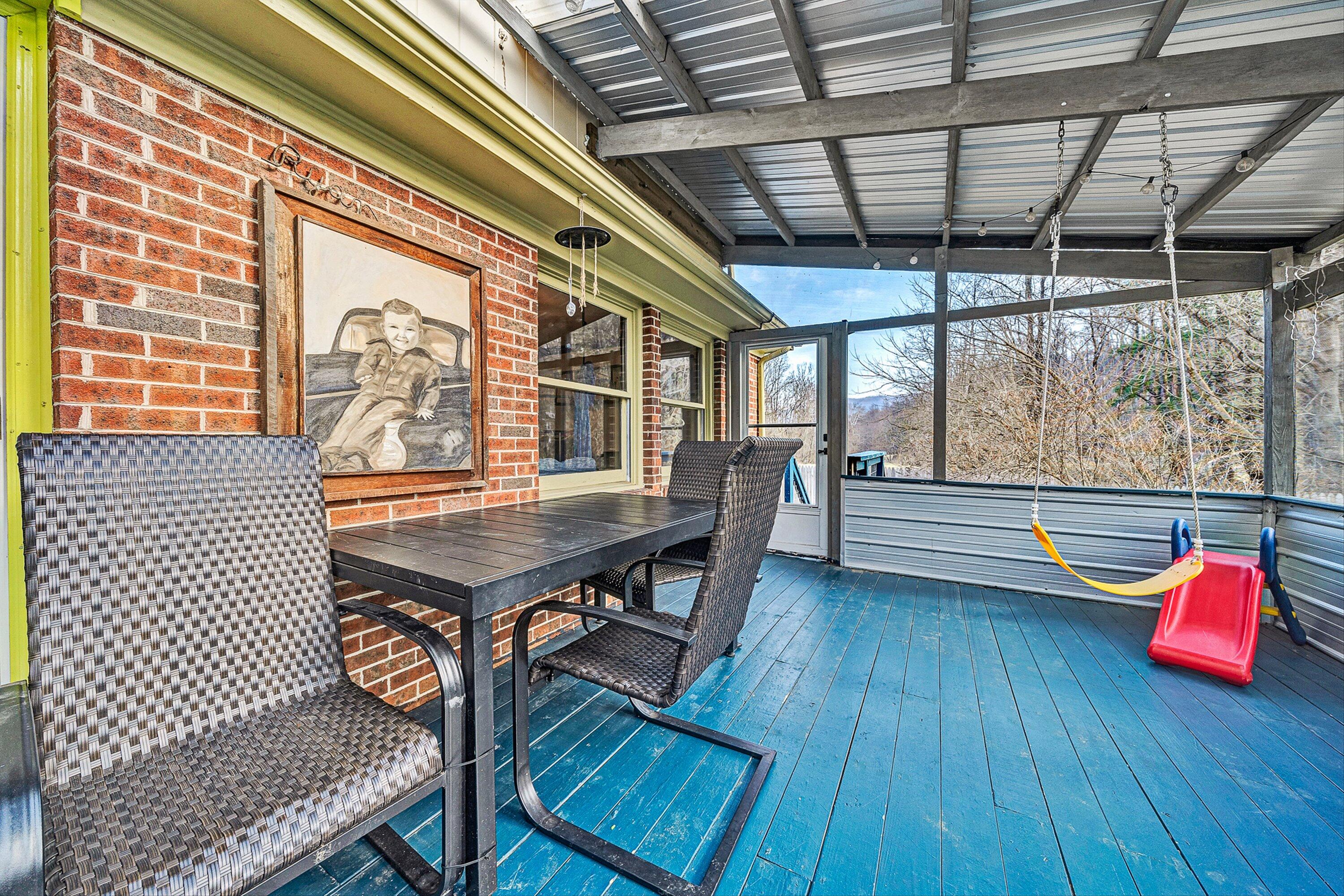 3305 Naff Road Boones Mill, VA 24065 - Photo 18 of 57 a balcony with wooden floors and outdoor seating