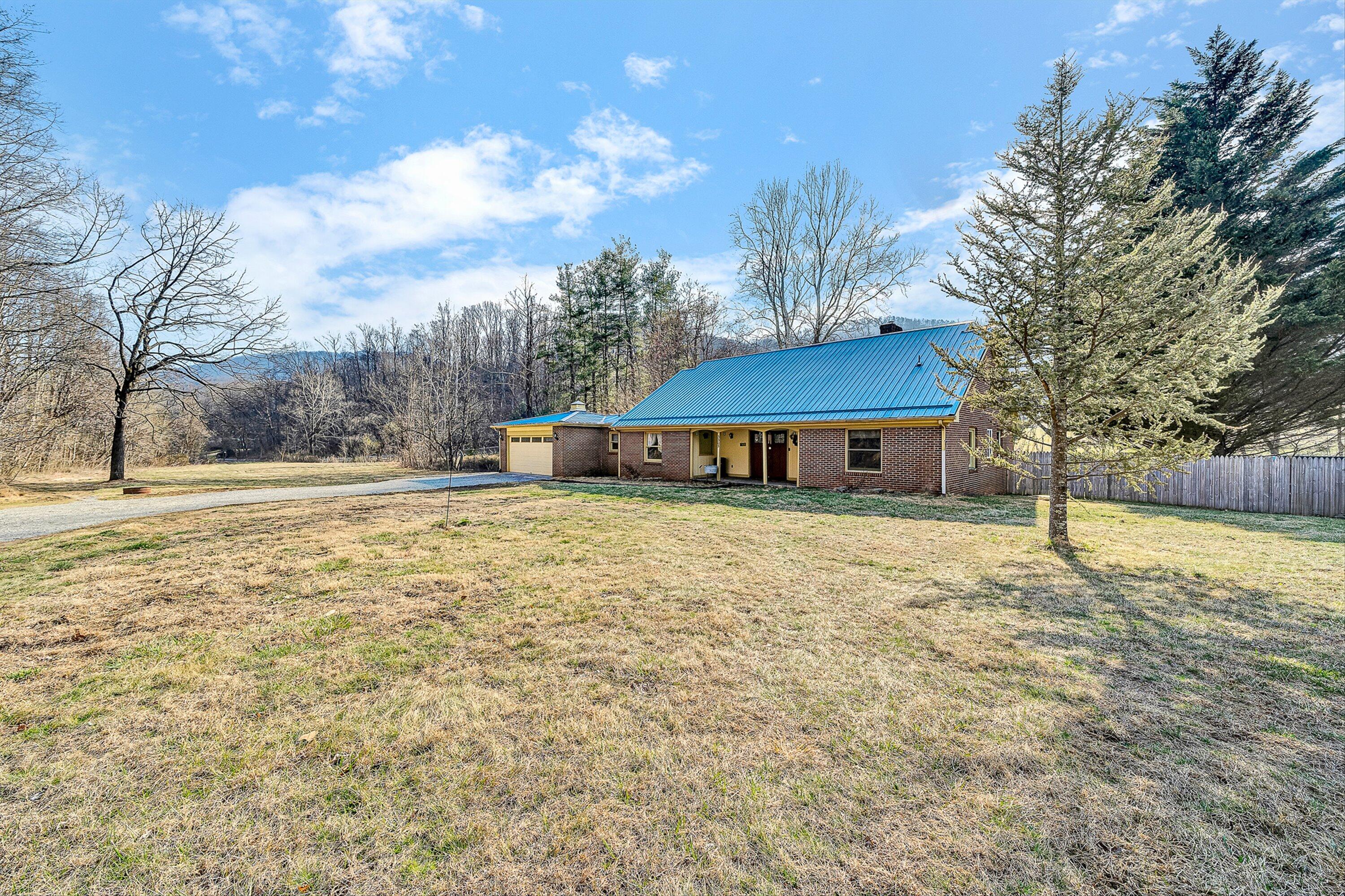 3305 Naff Road Boones Mill, VA 24065 - Photo 2 of 57 a front view of a house with a yard
