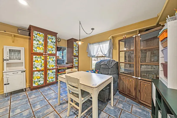a kitchen with stainless steel appliances granite countertop a refrigerator and a stove