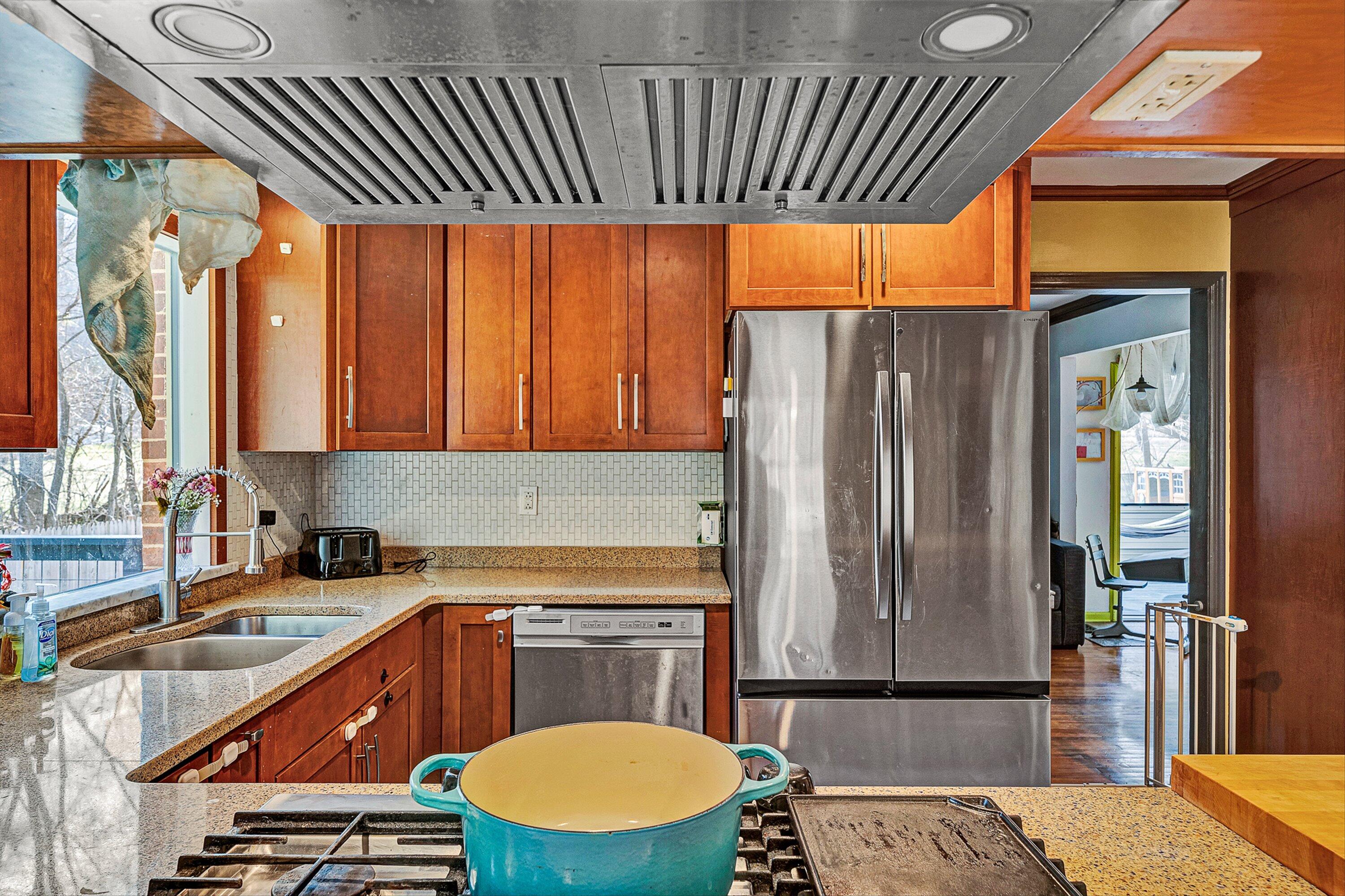 3305 Naff Road Boones Mill, VA 24065 - Photo 26 of 57 a kitchen with a sink and a refrigerator