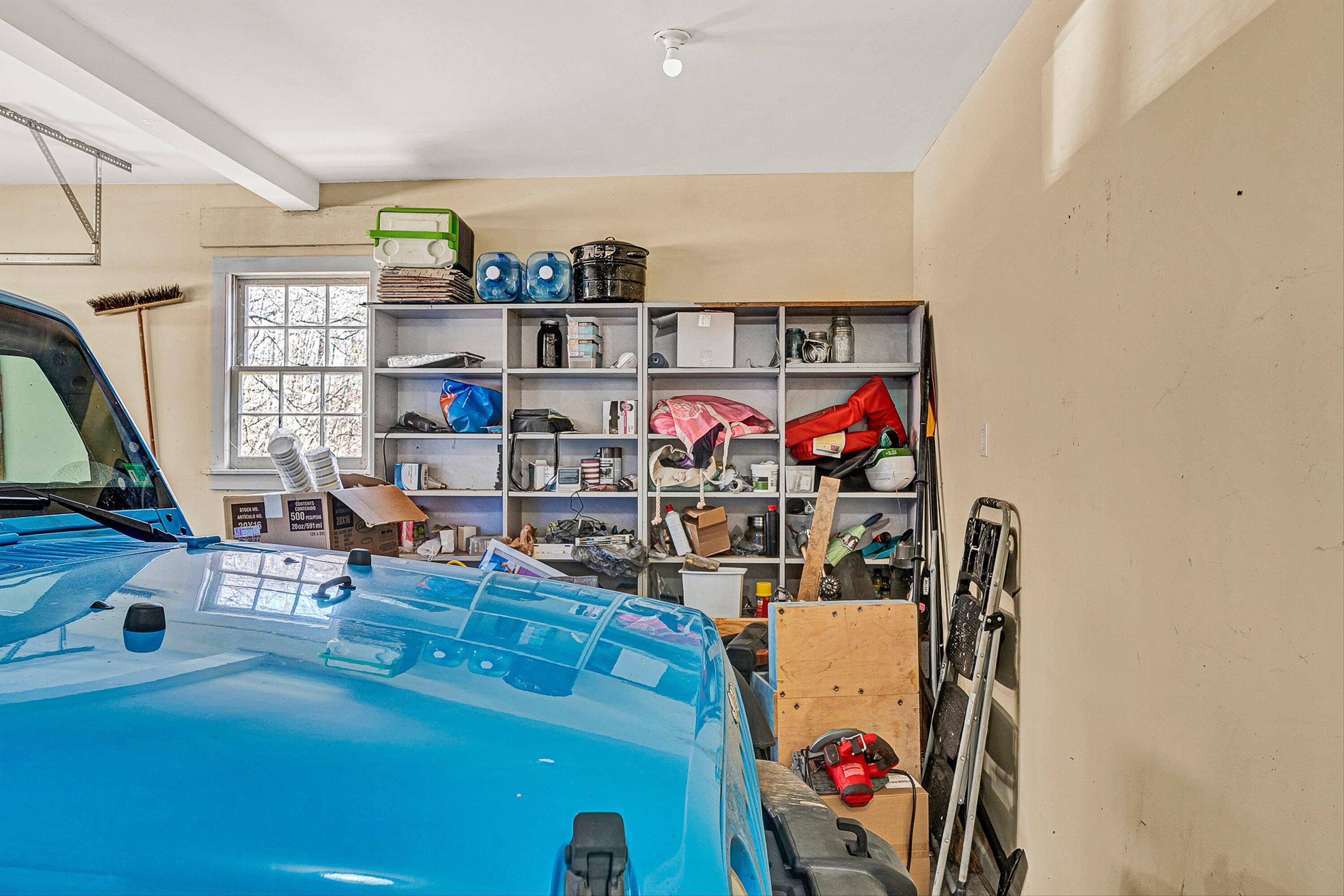3305 Naff Road Boones Mill, VA 24065 - Photo 29 of 57 a room with lots of books and white cabinets