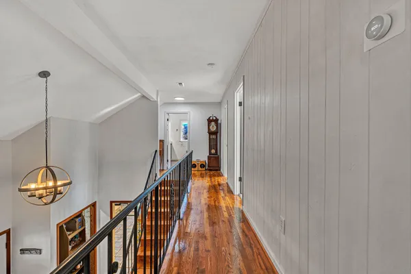 a view of a livingroom with furniture and a window