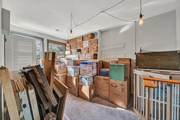 a bedroom with furniture and a window