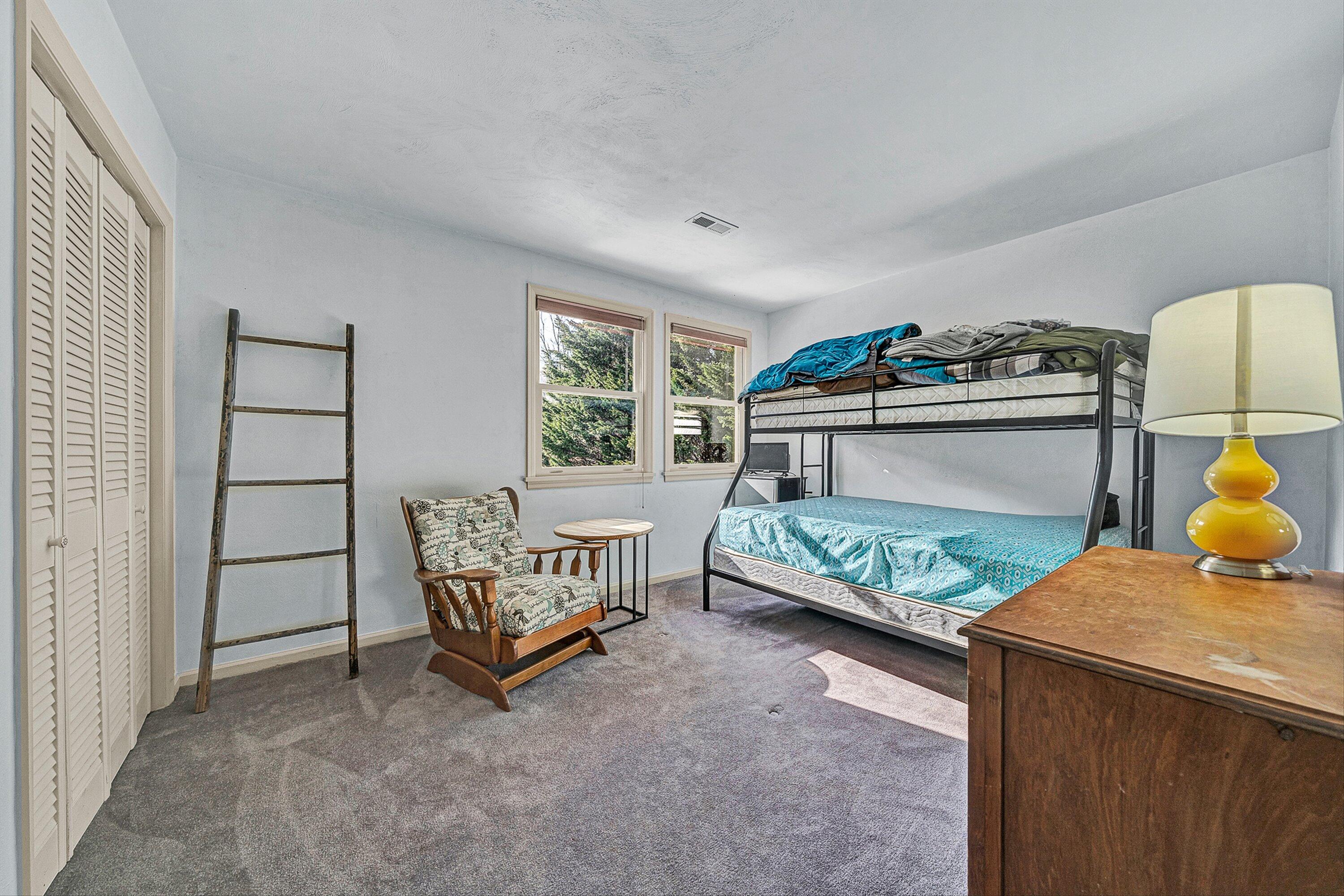 3305 Naff Road Boones Mill, VA 24065 - Photo 32 of 57 a bedroom with furniture and a window