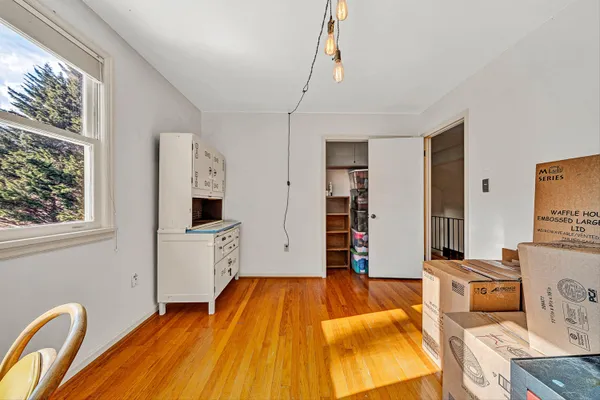 a view of a storage and utility room with closet
