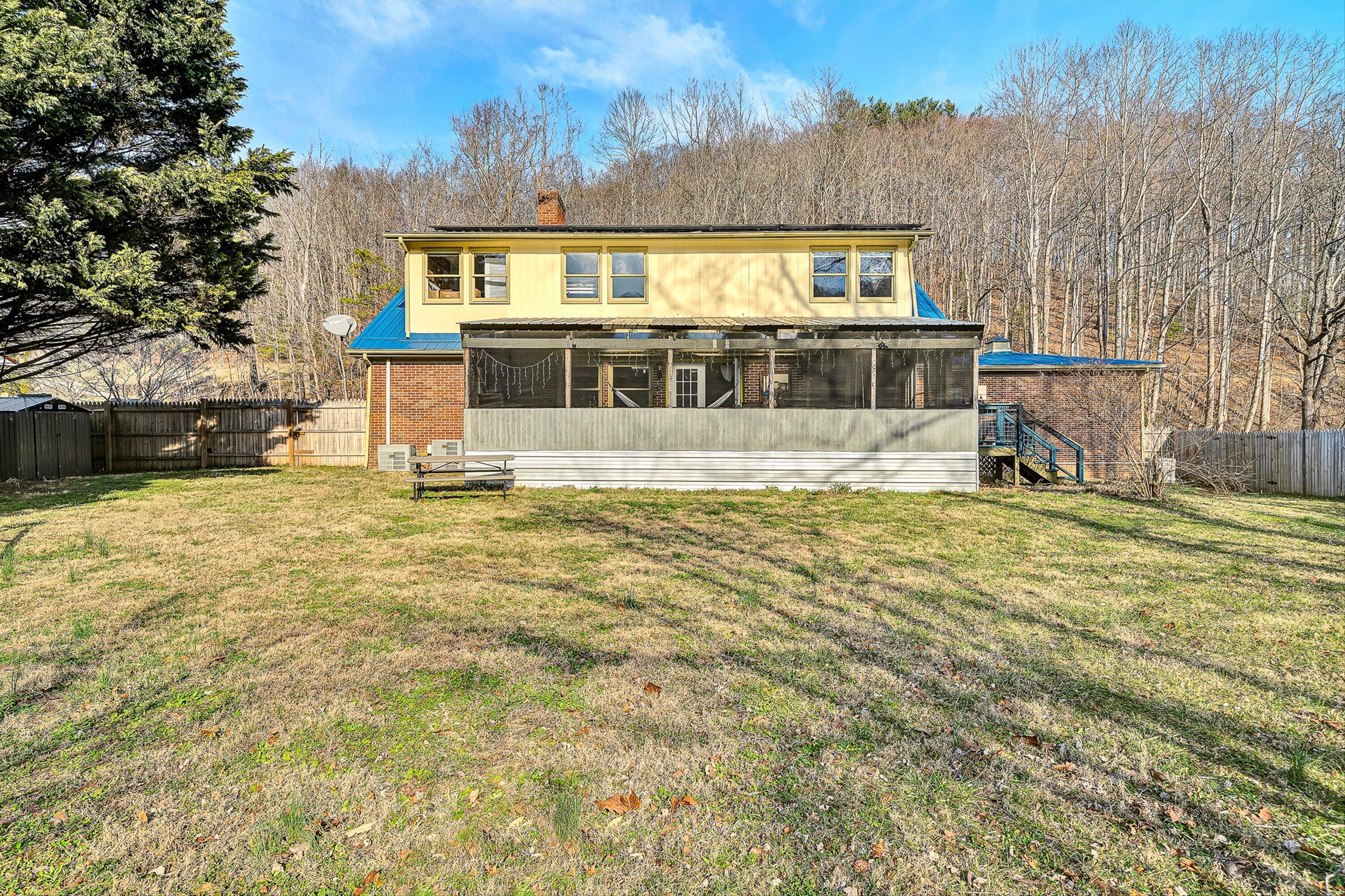 3305 Naff Road Boones Mill, VA 24065 - Photo 44 of 57 a front view of a house with a yard
