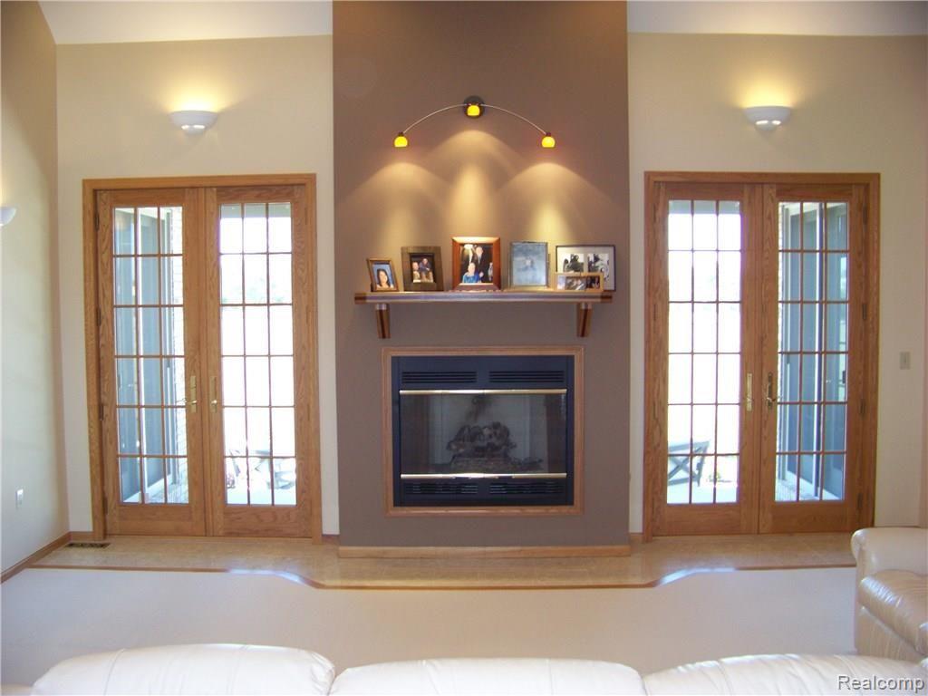 9967 Chinavare Road Newport, MI 48166 - Photo 13 of 45 Great room with gas fireplace. (Can be converted to natural.)