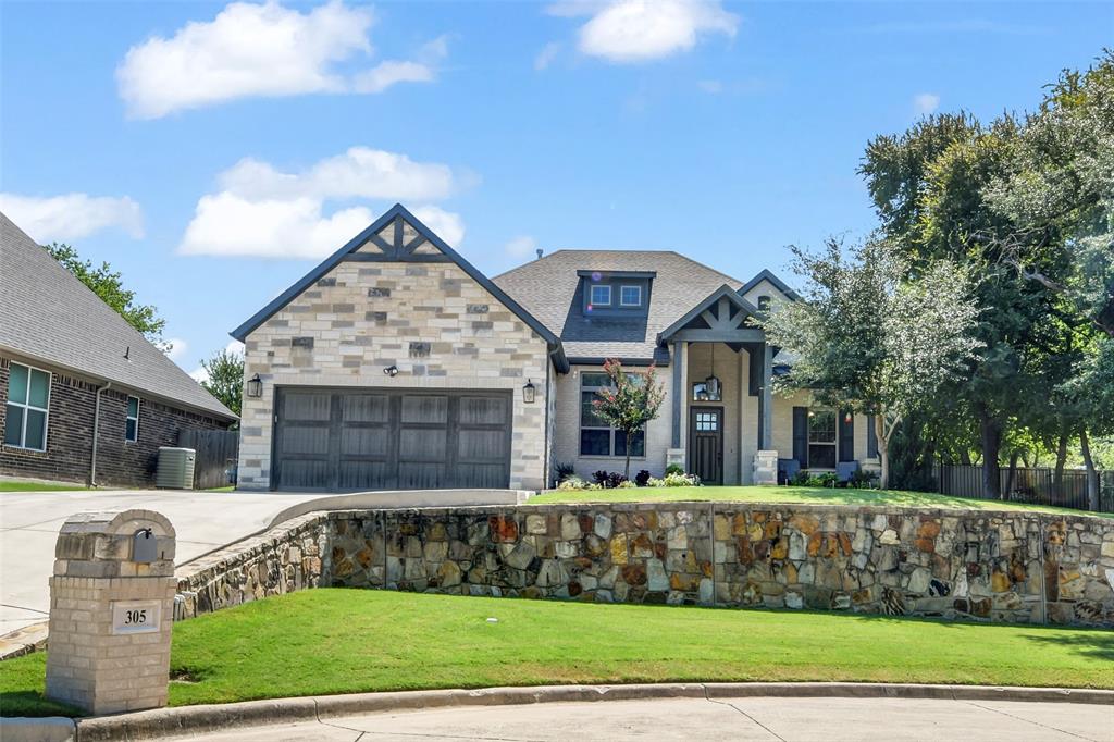 305 Familia Court Azle, TX 76020 - Photo 1 of 40 a front view of houses with yard