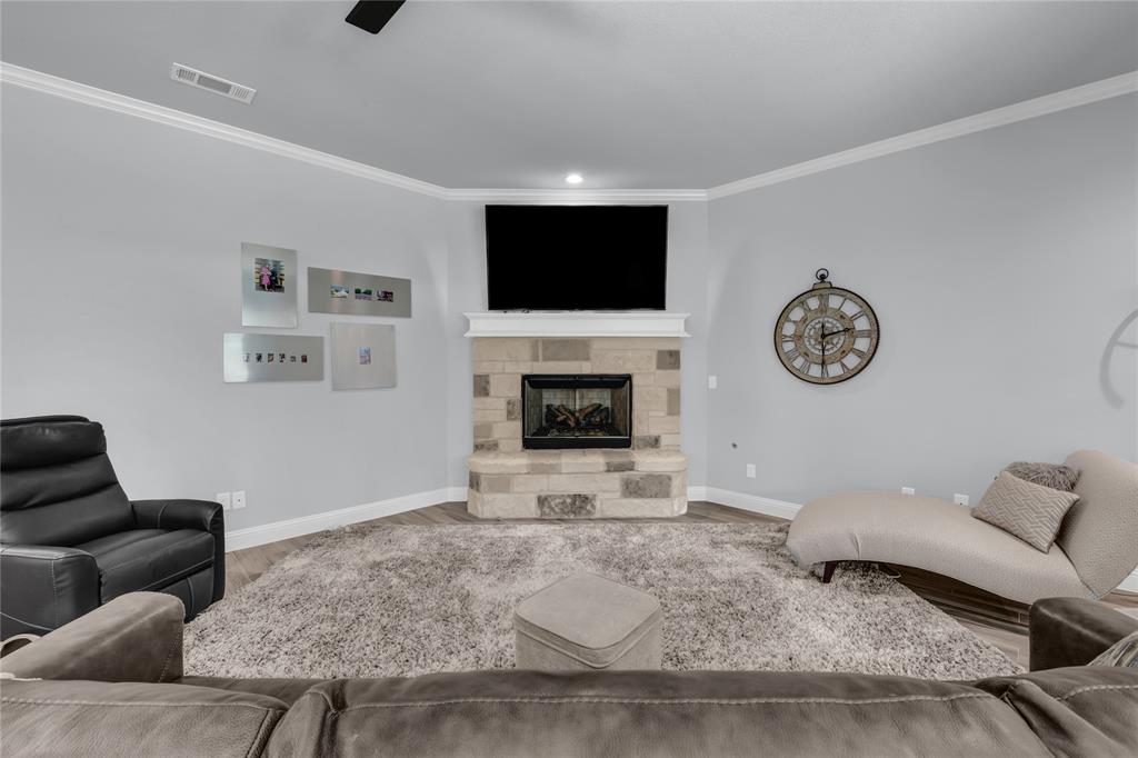 305 Familia Court Azle, TX 76020 - Photo 12 of 40 a living room with furniture and a flat screen tv