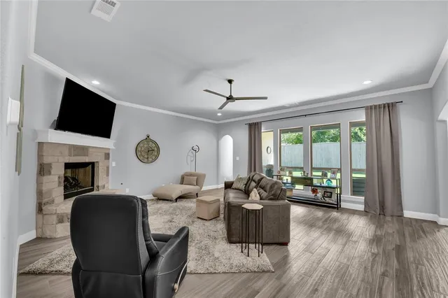 a living room with furniture and a large window