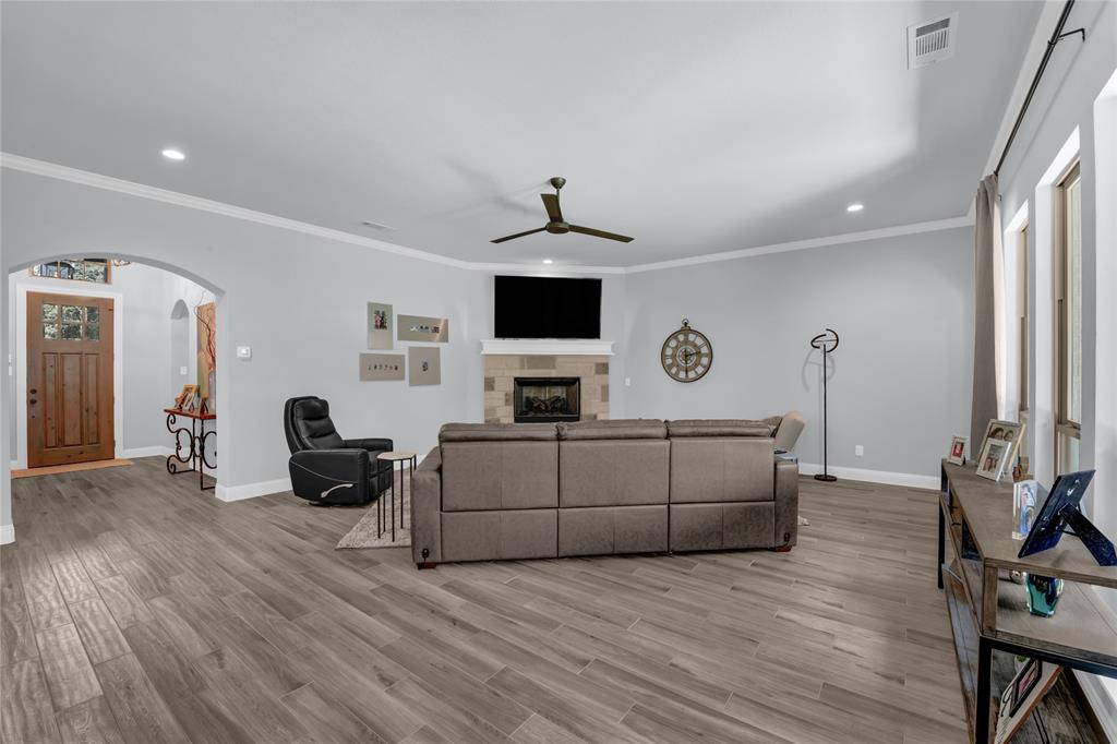 305 Familia Court Azle, TX 76020 - Photo 17 of 40 a living room with furniture and a wooden floor