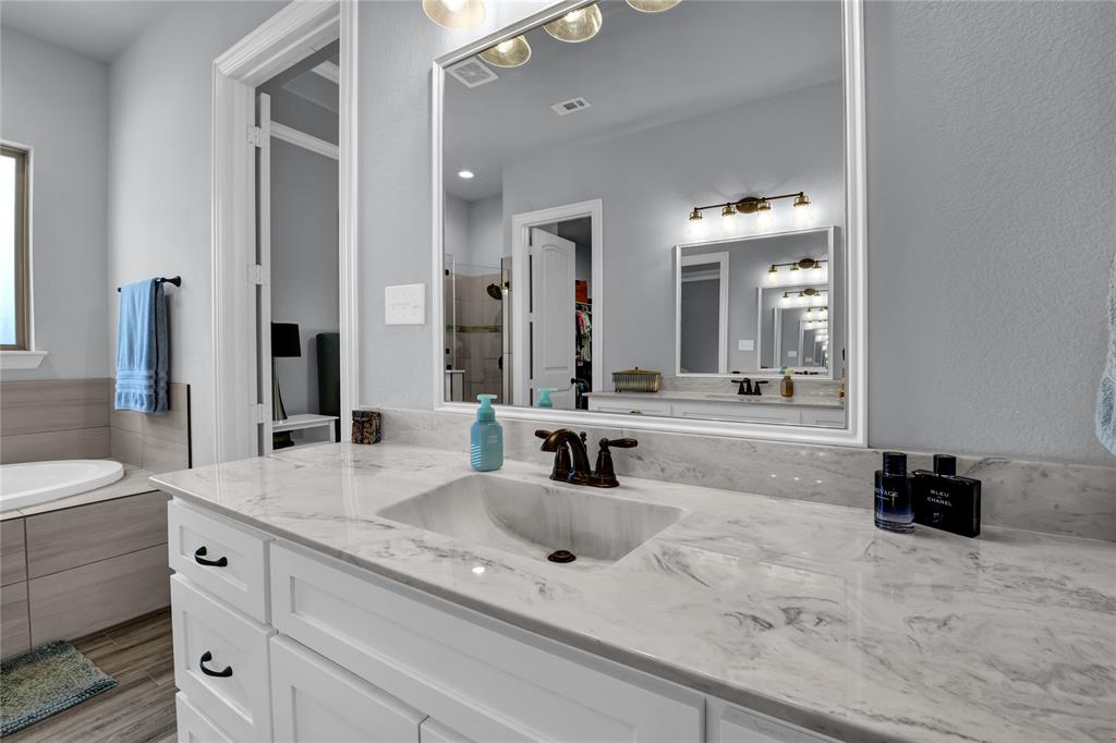 305 Familia Court Azle, TX 76020 - Photo 21 of 40 a bathroom with a sink double vanity