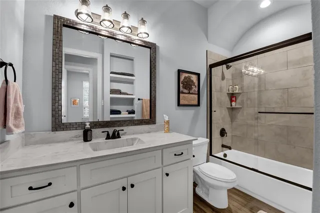 a bedroom with bed and a chandelier