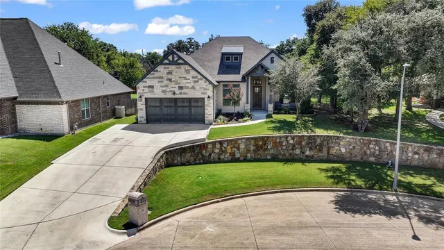 an aerial view of a house with a swimming pool
