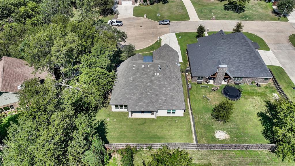 305 Familia Court Azle, TX 76020 - Photo 35 of 40 an aerial view of a house with a swimming pool
