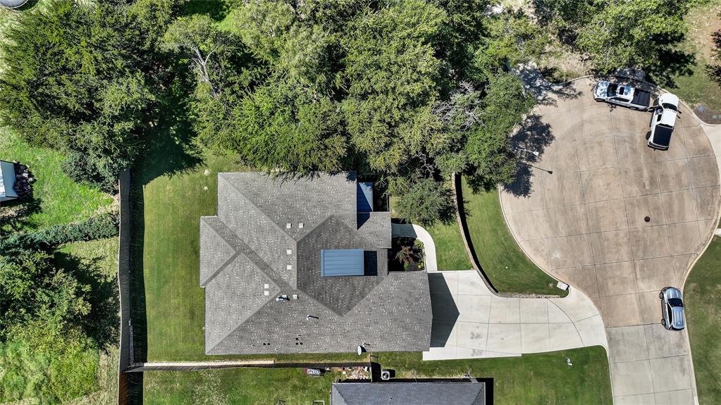 305 Familia Court Azle, TX 76020 - Photo 36 of 40 an aerial view of a house with swimming pool and large trees