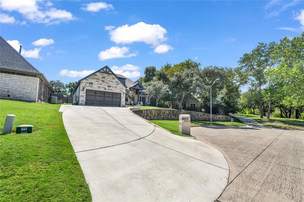 305 Familia Court Azle, TX 76020 - Photo 37 of 40 a view of a backyard with tree s
