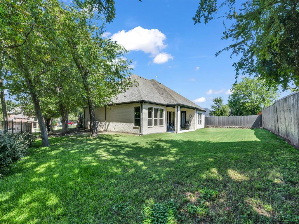 305 Familia Court Azle, TX 76020 - Photo 4 of 40 a front view of house with yard and green space
