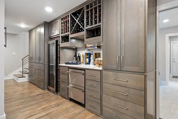 a kitchen with a refrigerator and cabinets