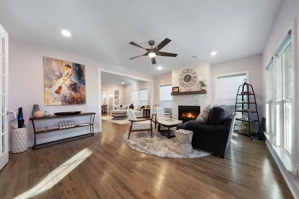 a living room with furniture fireplace and window