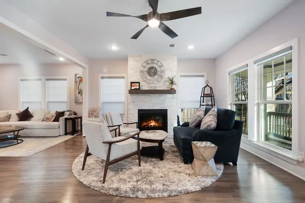 a living room with furniture and a fireplace