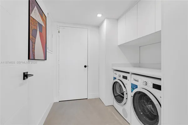 a view of a hallway with cabinet