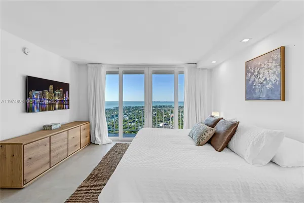 a bedroom with a bed and a walk in closet