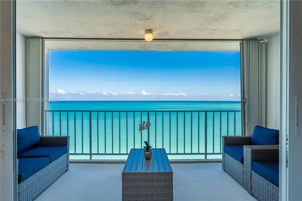 an aerial view of a house with a lake view