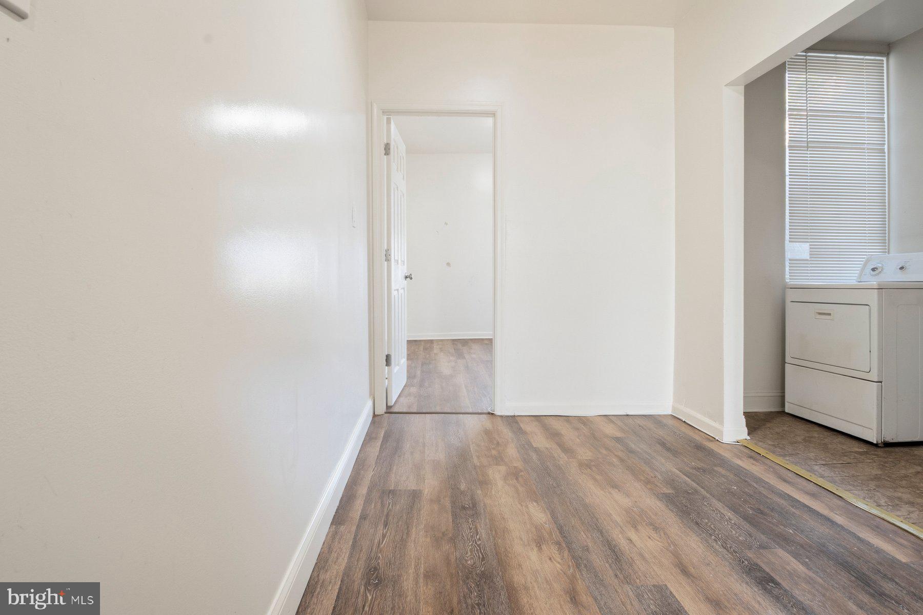 322 South Pulaski Street Baltimore, MD 21223 - Photo 14 of 28 a view of a room with wooden floor and a sink