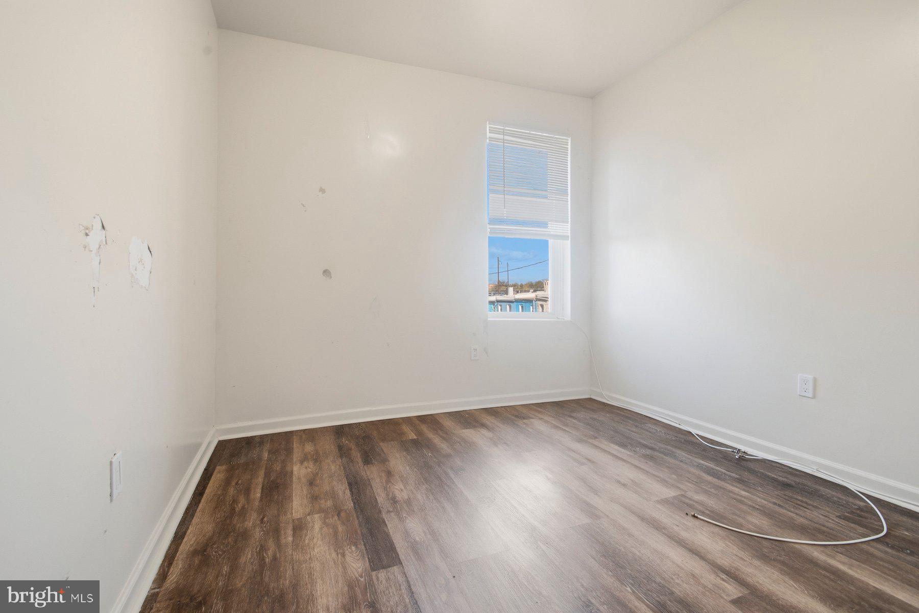 322 South Pulaski Street Baltimore, MD 21223 - Photo 15 of 28 an empty room with a window
