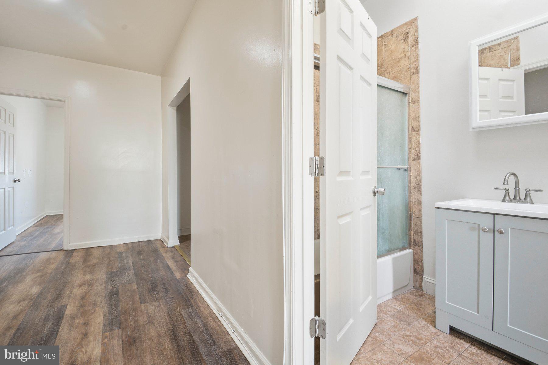 322 South Pulaski Street Baltimore, MD 21223 - Photo 19 of 28 a view of a hallway with wooden floor and closet area