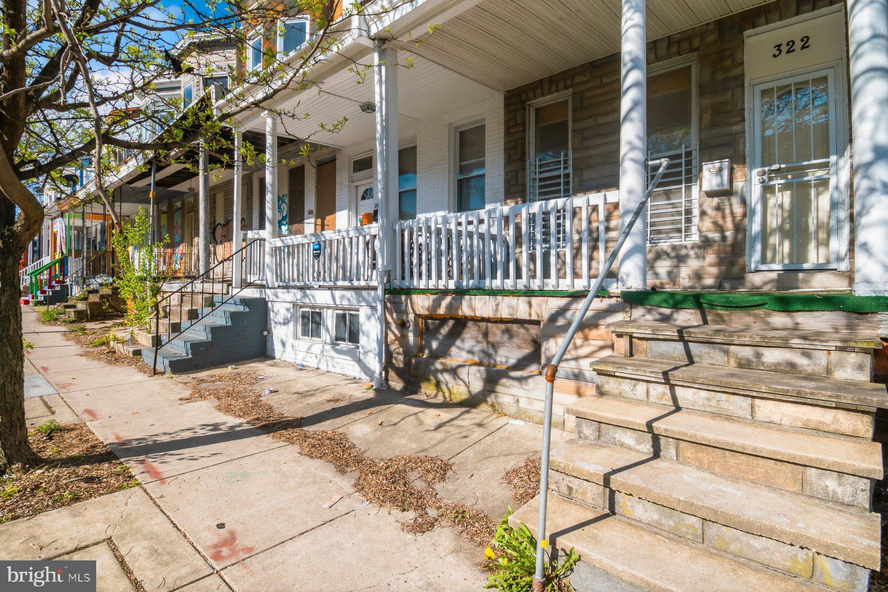 322 South Pulaski Street Baltimore, MD 21223 - Photo 2 of 28 a view of a house with backyard and sitting area