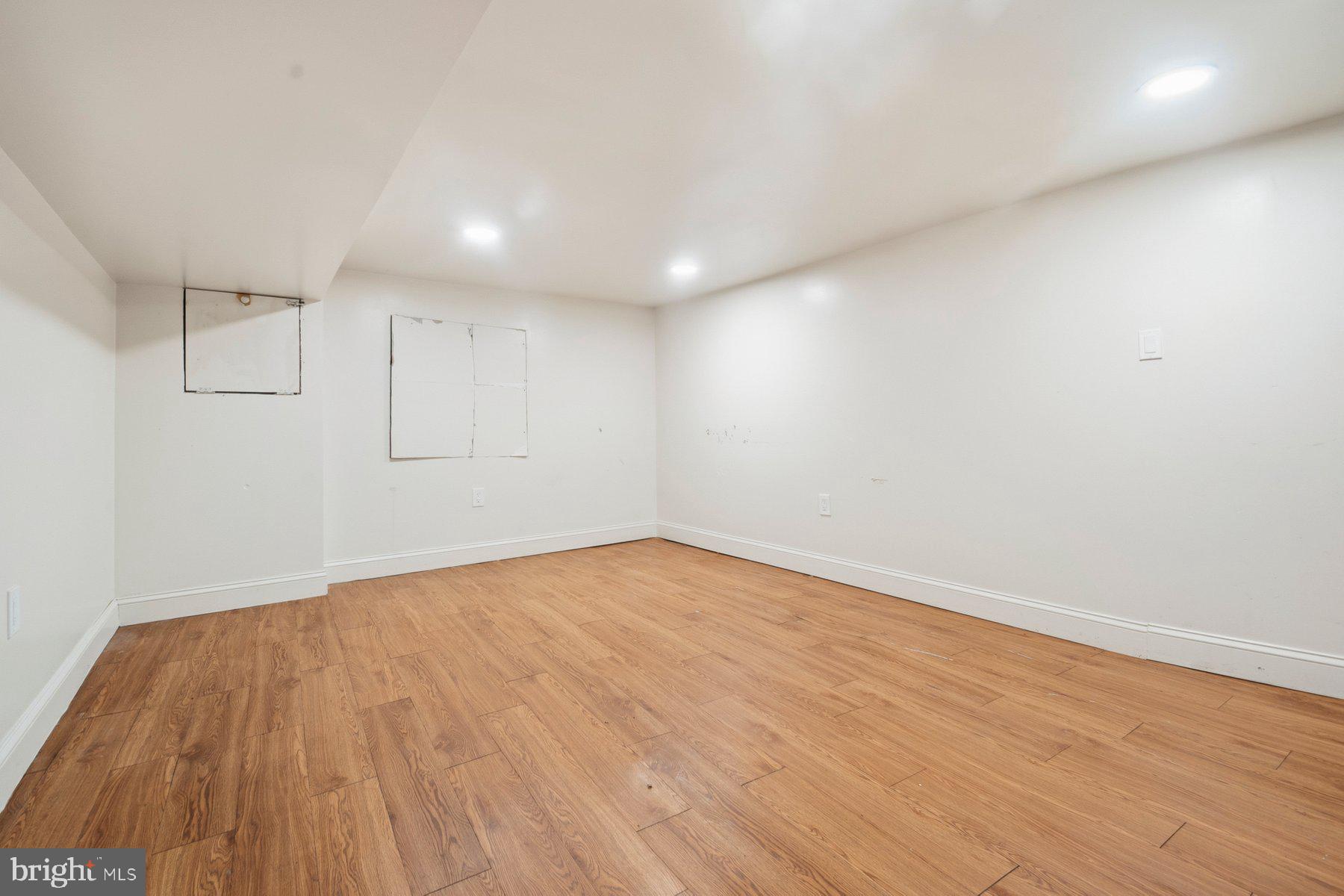 322 South Pulaski Street Baltimore, MD 21223 - Photo 28 of 28 a view of empty room with wooden floor