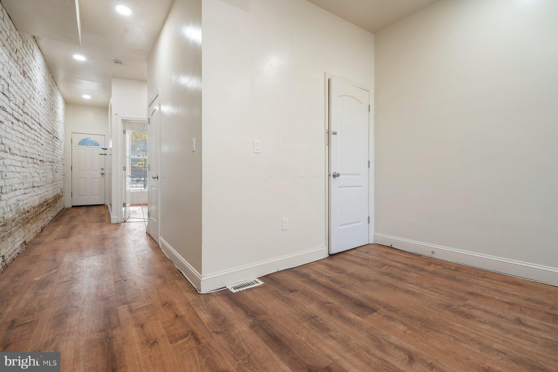 322 South Pulaski Street Baltimore, MD 21223 - Photo 9 of 28 a view of a hallway with wooden floor